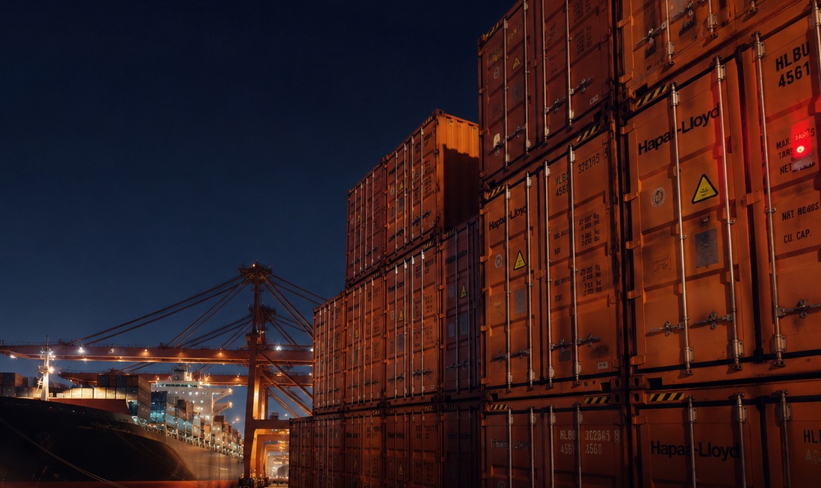 Close view of container ship and stacks in a harbor